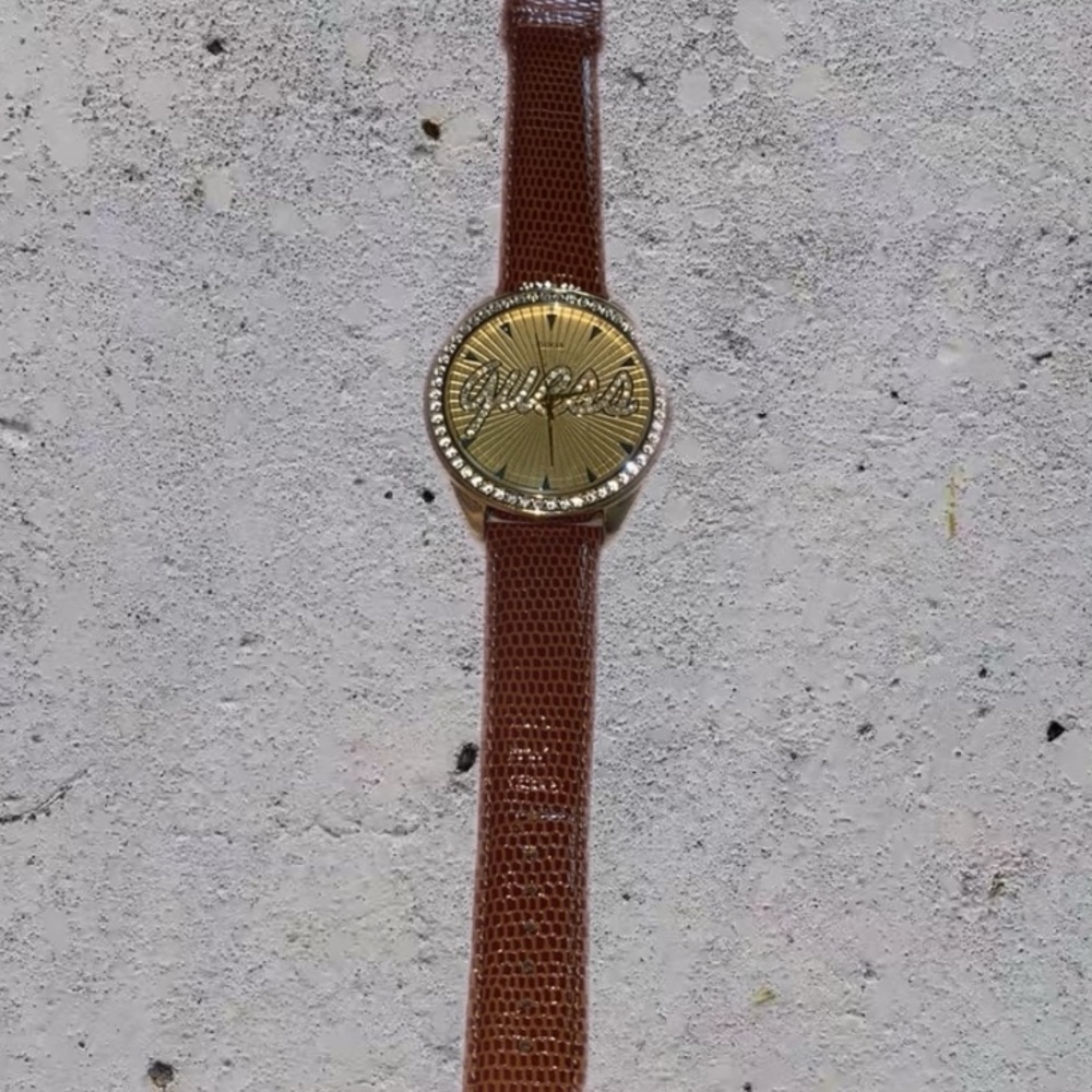 Gold Guess watch with tan leather band 100$